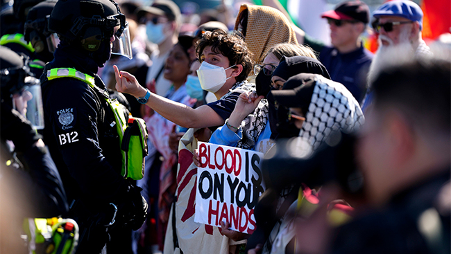 Ottawa police arrest 13 anti-war protesters demonstrating against arms show